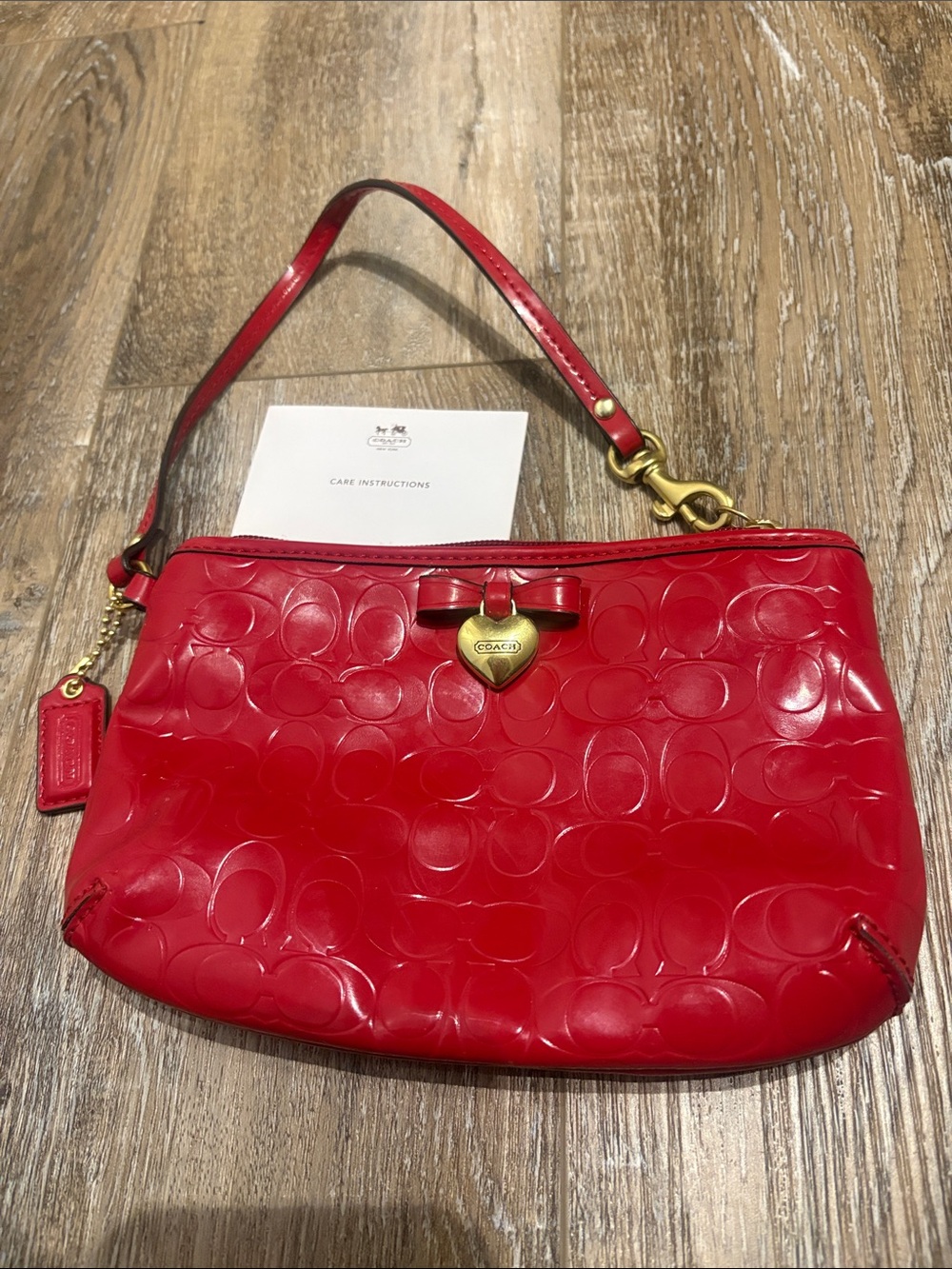 Vintage COACH Red Patent Signature Wristlet with Gold Heart Charm